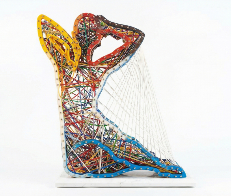 Stretching Silhouette by AvRaam Cohen – Freestanding epoxy/silicon/aluminum/steel/marble sculpture of seated woman with vibrant custom elastic bands as internal ligaments creating dynamic tension, 30” x 30” x 9.25”